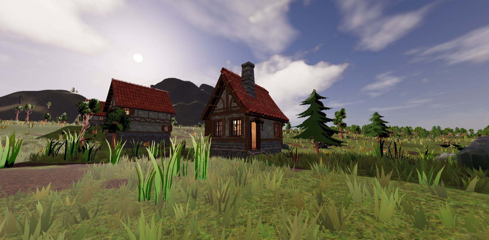 Cottages in a meadow under a bright, cloudy sky